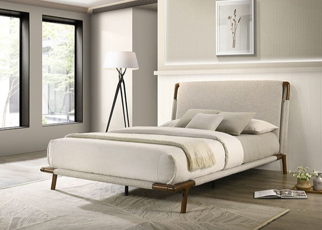 Jenni Bed Mid Century Modern Beige Fabric Modern bedroom with a beige upholstered bed and wooden legs.