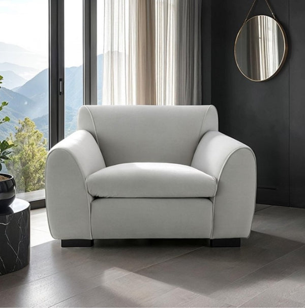 Karl Gray Contemporary Chenille Fabric Chair Gray armchair in a modern living room with large windows and a mountain view.