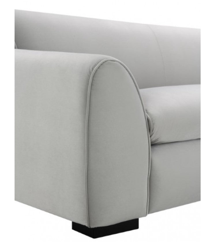Karl Gray Contemporary Chenille Fabric Sofa Gray sofa in a modern living room with a lamp and abstract art on the wall.