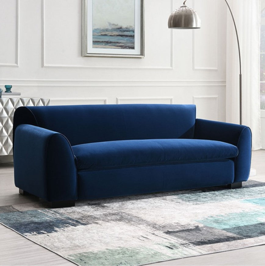 Karl Royal Blue Contemporary Chenille Fabric Sofa Blue sofa in a living room with a rug and wall art