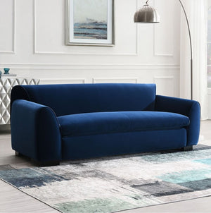 Karl Royal Blue Contemporary Chenille Fabric Sofa Blue sofa in a living room with a rug and wall art