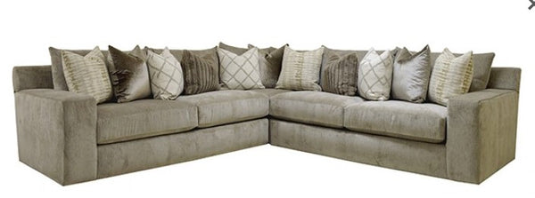 Kenny Oversized Sectional Sofa Beige sectional sofa with decorative pillows on a white background