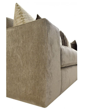 Beige sofa with decorative pillows on a white background