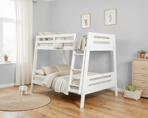 Kerran Bunkbed White Angled Twin Full White bunk bed in a room with wooden flooring and light gray walls.