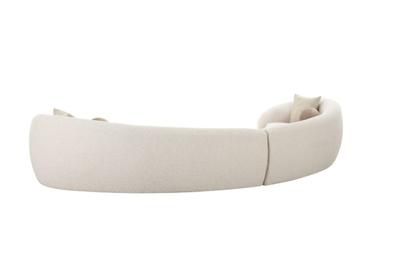 Kilmer Off White Fabric Curved Modern Sectional Sofa A curved modular upholstered sofa bed in a light cream or off-white fabric, shown from a side angle on a plain white background.