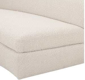 Kilmer Off White Fabric Curved Modern Sectional Sofa Close-up of a textured bouclé upholstered sofa corner in a warm off-white or cream color, showing the fabric weave and seat cushion seam.