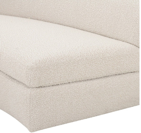 Kilmer Off White Fabric Curved Modern Sectional Sofa Close-up of a textured bouclé upholstered sofa corner in a warm off-white or cream color, showing the fabric weave and seat cushion seam.