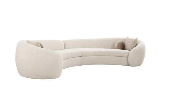 Kilmer Off White Fabric Curved Modern Sectional Sofa A modern curved upholstered sofa in a light cream or off-white fabric, featuring rounded tubular arms and two matching throw pillows, shown against a plain white background.