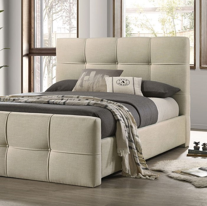Koall Ivory Fabric Biscuit Button Tufting Bed Beige upholstered bed with gray bedding in a room with large windows.