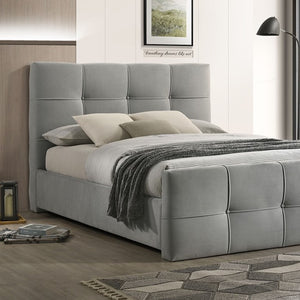 Koall Light Gray Fabric Biscuit Button Tufting Bed Gray upholstered bed with pillows and a blanket in a bedroom setting.