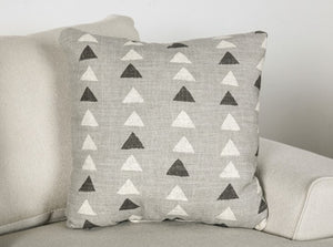 Kriska Light Gray Fabric Sofa with Pillows Gray pillow with triangle pattern on a beige sofa