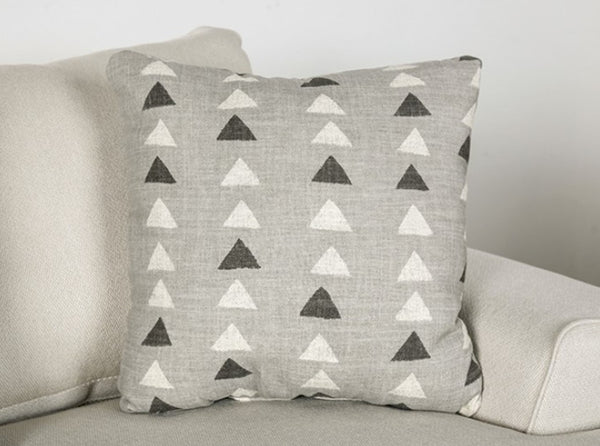 Kriska Light Gray Fabric Sofa with Pillows Gray pillow with triangle pattern on a beige sofa