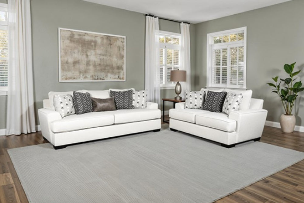 Kriska Light Gray Fabric Loveseat with Pillows White sofa with patterned cushions in a living room setting