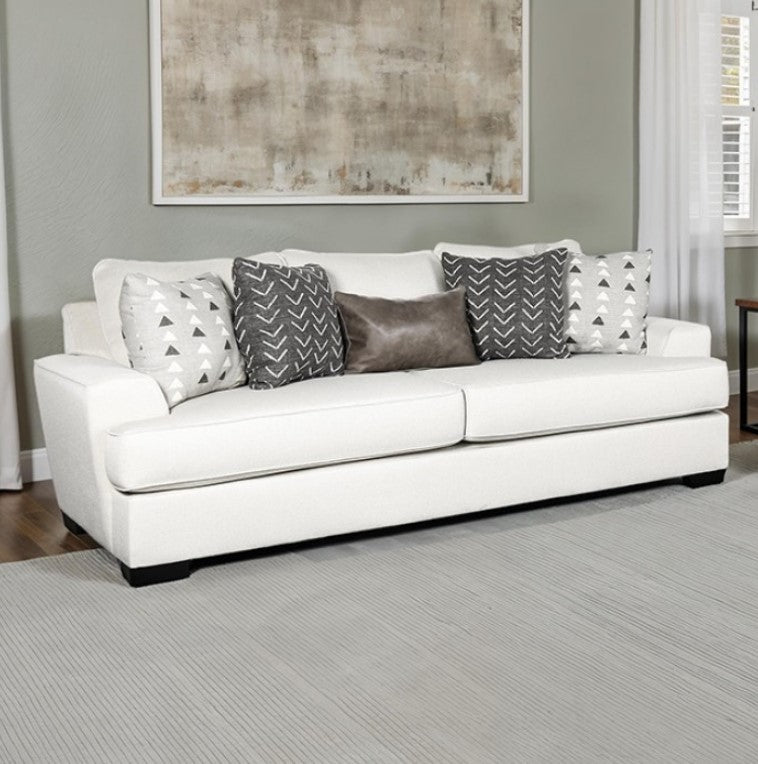 Kriska Light Gray Fabric Sofa with Pillows White sofa with patterned cushions in a living room setting
