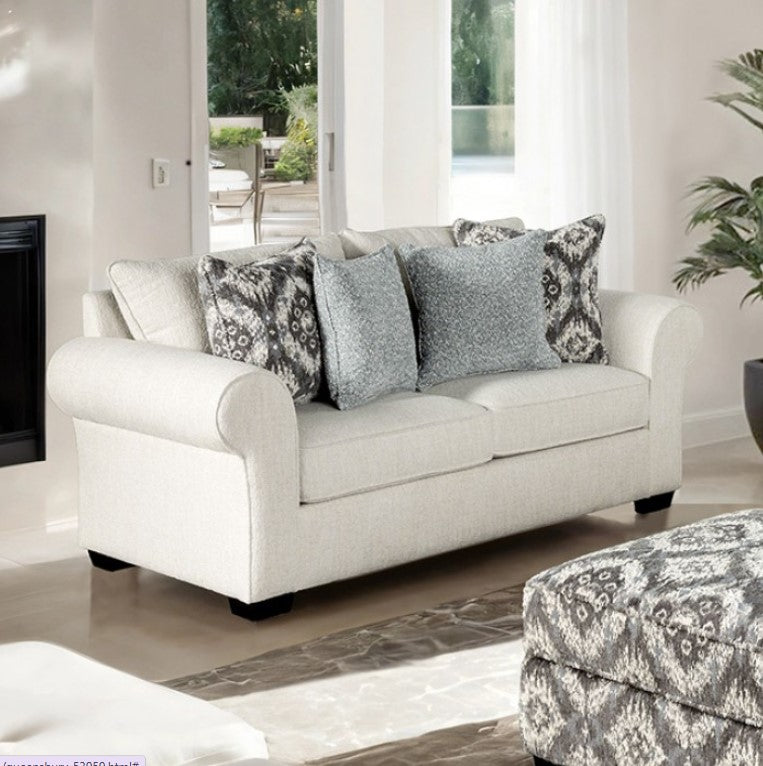 Kumar Rolled Arm White Fabric Loveseat White sofa with patterned cushions in a living room setting