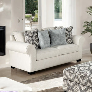 Kumar Rolled Arm White Fabric Loveseat White sofa with patterned cushions in a living room setting