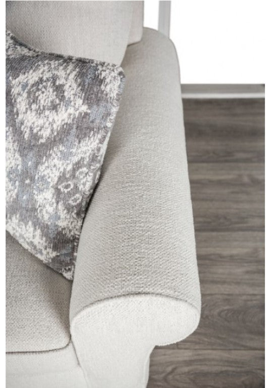 Kumar Rolled Arm White Fabric Sofa Gray textured throw blanket draped over a sofa with a wooden floor in the background
