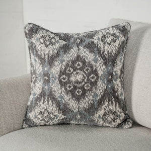 Decorative pillow with a pattern on a gray sofa
