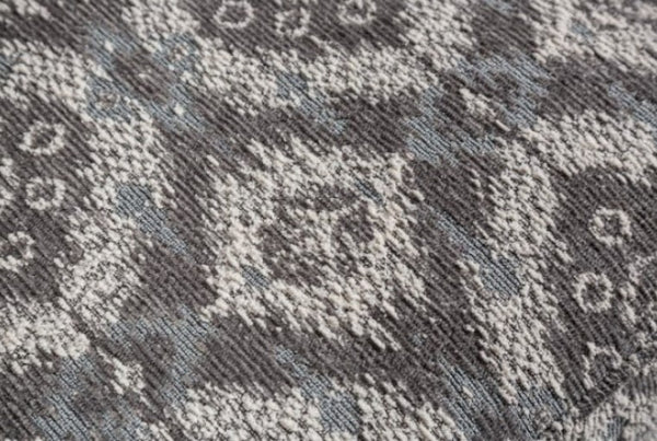 Close-up of a textured gray and white patterned fabric