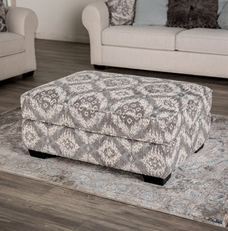 Kumar Transitional White-Gray Fabric Ottoman Patterned ottoman in a living room setting with a couch and chair.
