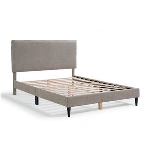 Gray upholstered bed frame on a white background