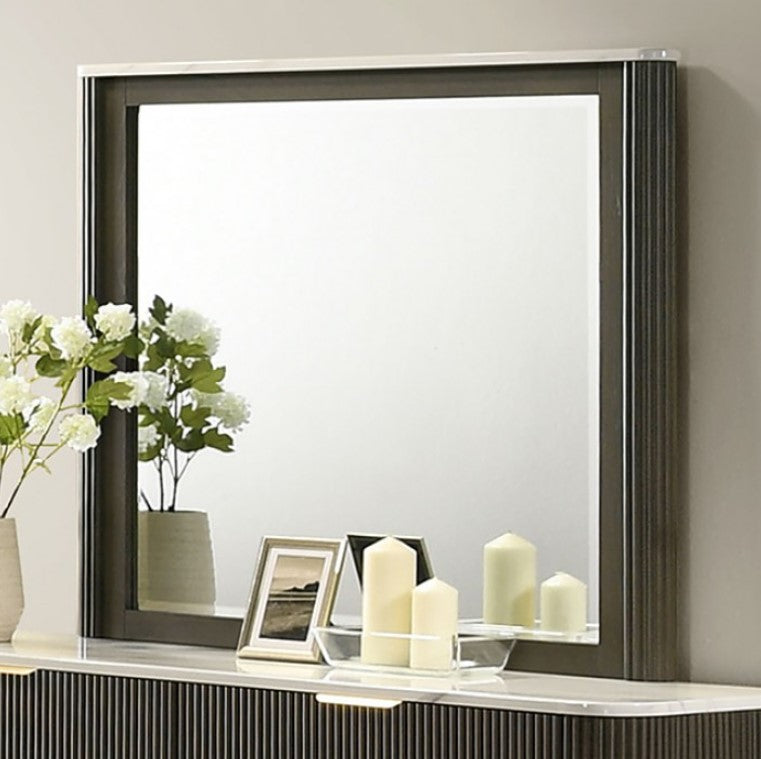 Laura Modern Dark Mirror Decorative shelf with candles, flowers, and a mirror in a dark frame.