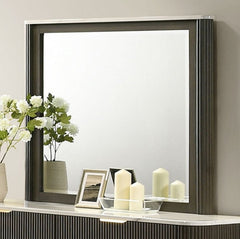 Laura Modern Dark Mirror Decorative shelf with candles, flowers, and a mirror in a dark frame.