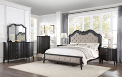Lesley Button Tufted Camel Back Headboard Bed Neatly arranged bedroom with a bed, dresser, and mirror.