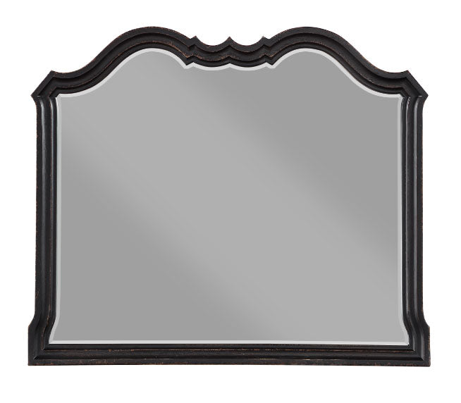 Lesley Camel Back Mirror A dark wood dresser with an attached arched mirror, styled in a bright room with a window, lamp, and decorative items.