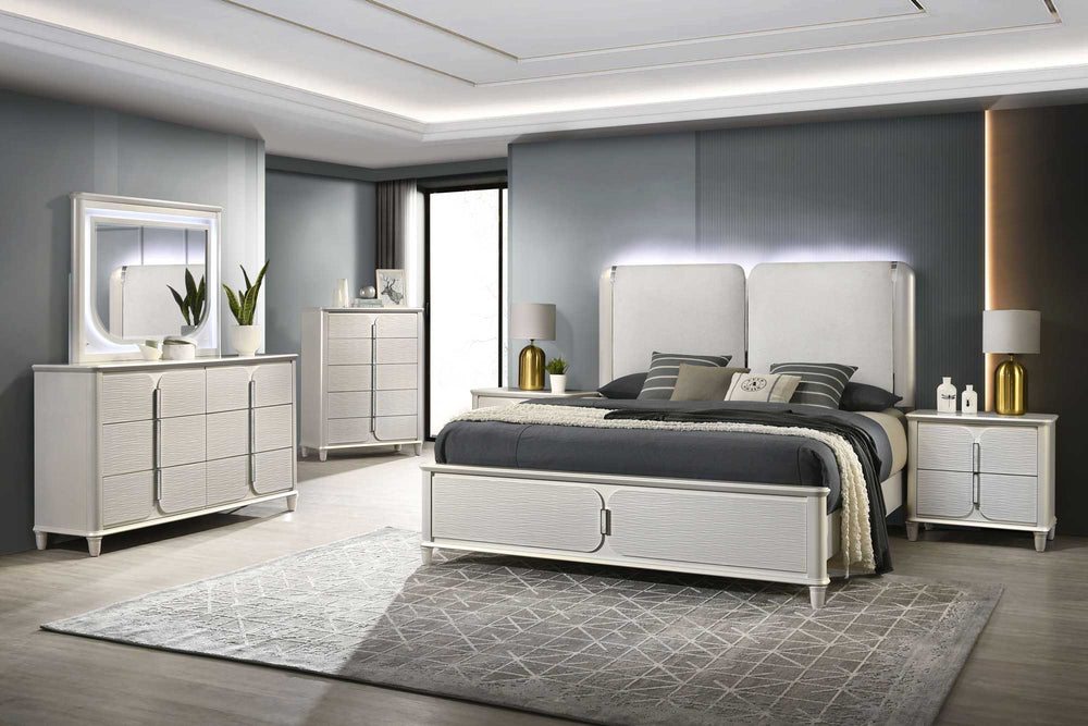 Liberia Modern Bedroom Collection Modern bedroom set with white furniture, including bed, dressers, and nightstands, in a well-lit room.