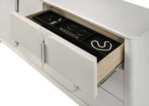Open jewelry drawer with organized jewelry inside on a white background