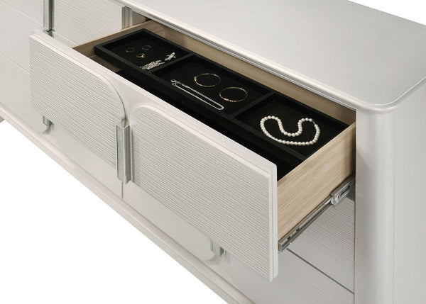 Open jewelry drawer with organized jewelry inside on a white background