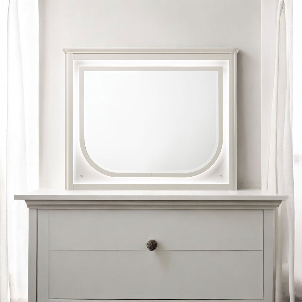 Liberia Modern Bedroom Mirror Collection White dresser with a mirror above it against a white wall.