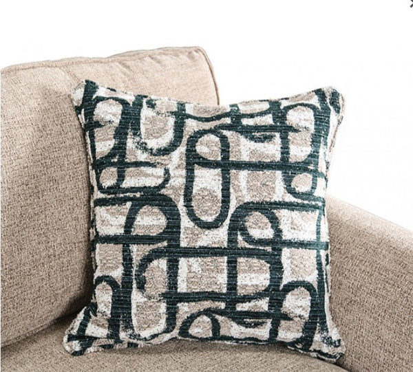 Decorative pillow with black abstract pattern on beige sofa