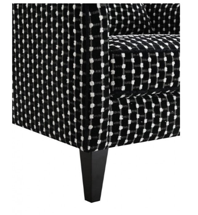 Logen Black Dots Chenille Fabric Accent Chair Black and white patterned armchair on a white background