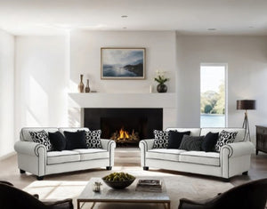 Logen White Chenille Fabric Sofa With Pillows Set Modern living room with white sofas, a fireplace, and decorative items.
