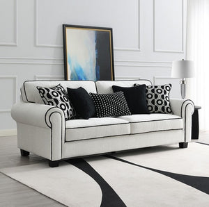 Logen White Chenille Fabric Sofa With Pillows White sofa with patterned cushions in a living room setting