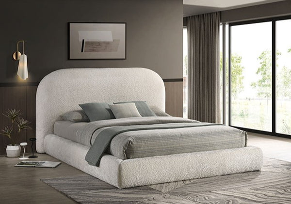 Lucia Round Headboard Ivory Fabric Bed Modern bedroom with a gray upholstered bed and large windows.