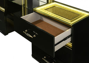 Luna Modern Black Gold Accent Led Nightstand Luxurious black and gold desk with an open drawer