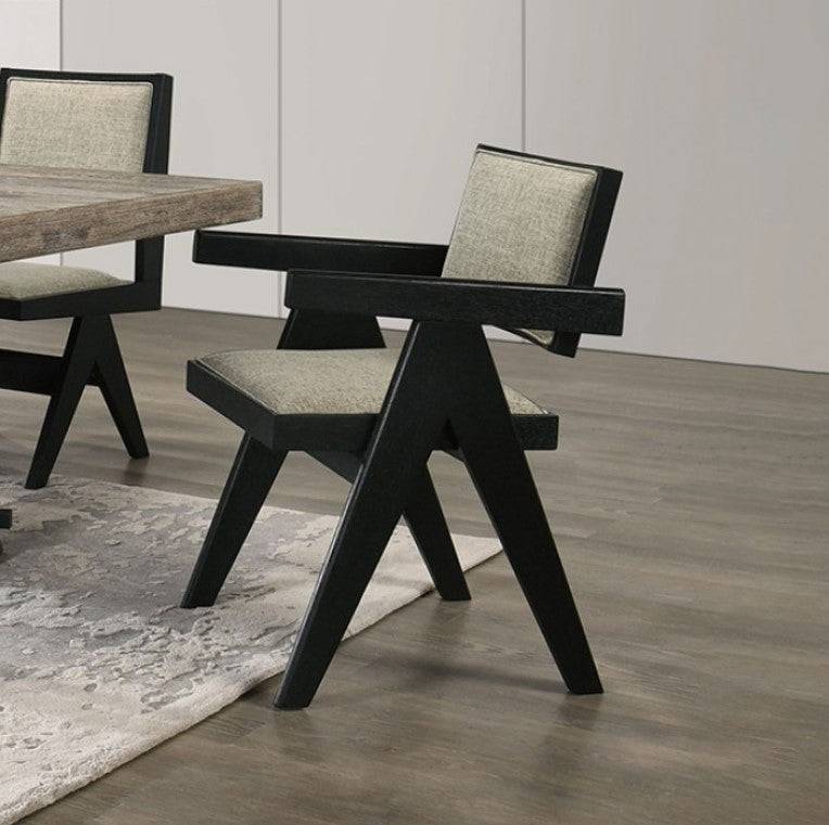 Maeve Contemporary Black Finish Dining Arm Chair Modern black chair with gray cushion on a wooden floor