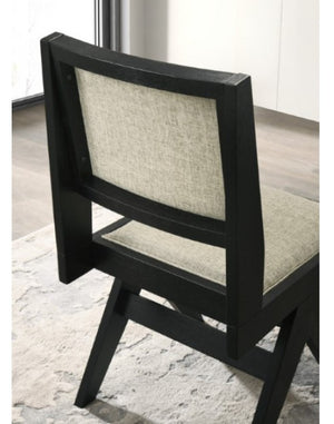 Maeve Contemporary Black Finish Dining Chair Black chair with a textured backrest and seat on a light-colored floor.