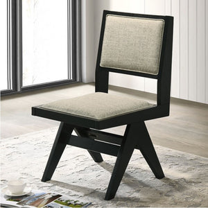 Maeve Contemporary Black Finish Dining Chair Modern chair with black frame and gray cushion in a room with large windows.