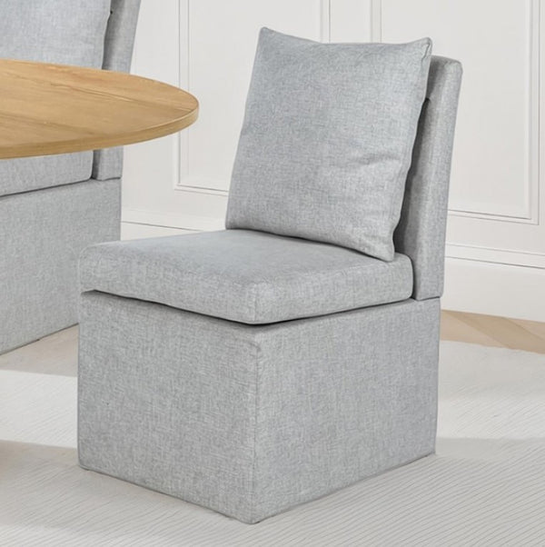 Maeve Contemporary Taupe Fully Upholstered Chair Gray upholstered chair with a wooden table in a room setting