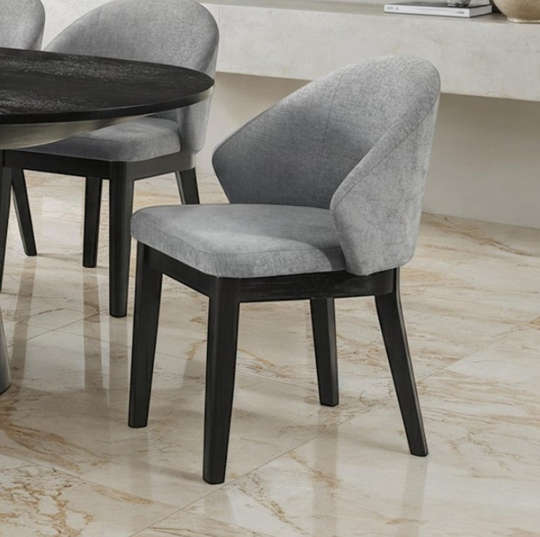 Maeve Organic Modern Black Finish Dining Chair Gray upholstered chair with black legs on a marble floor