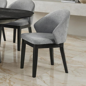 Maeve Organic Modern Black Finish Dining Chair Gray upholstered chair with black legs on a marble floor