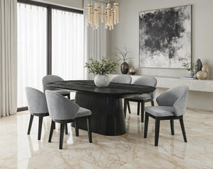 Maeve Oval Contemporary Black Finish Dining Table Modern dining room with a black round table and gray chairs.