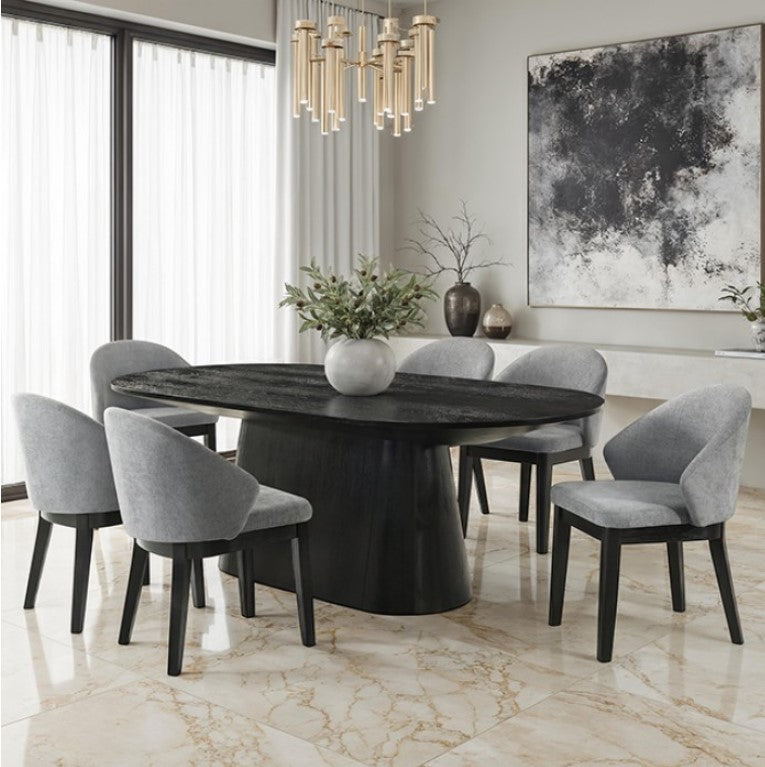Maeve Oval Contemporary Black Finish Dining Table Dining room with a round black table and gray chairs, featuring a chandelier and abstract art.