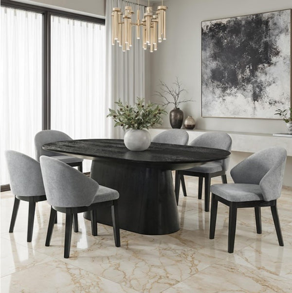 Maeve Oval Contemporary Black Finish Dining Table Dining room with a round black table and gray chairs, featuring a chandelier and abstract art.
