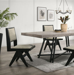 Maeve Rectangular Contemporary Black Finish Dining Table Dining room with a wooden table and chairs on a gray rug, plants, and wall art.