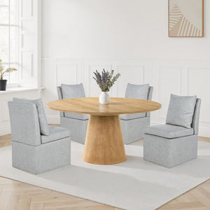 Dining room with a wooden table and gray chairs on a white rug.